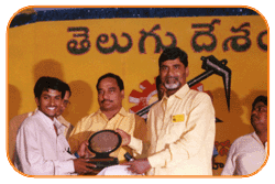 Mr. N Bitra Receiving A memento from Sri. N Chandra Babu Naidu, Ex. Chief Minister of Andhra Pradesh, India.